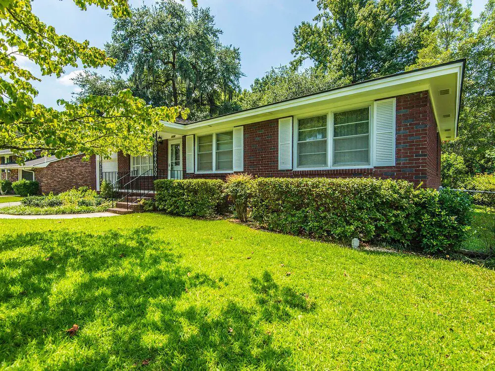 Single-story house with lush garden