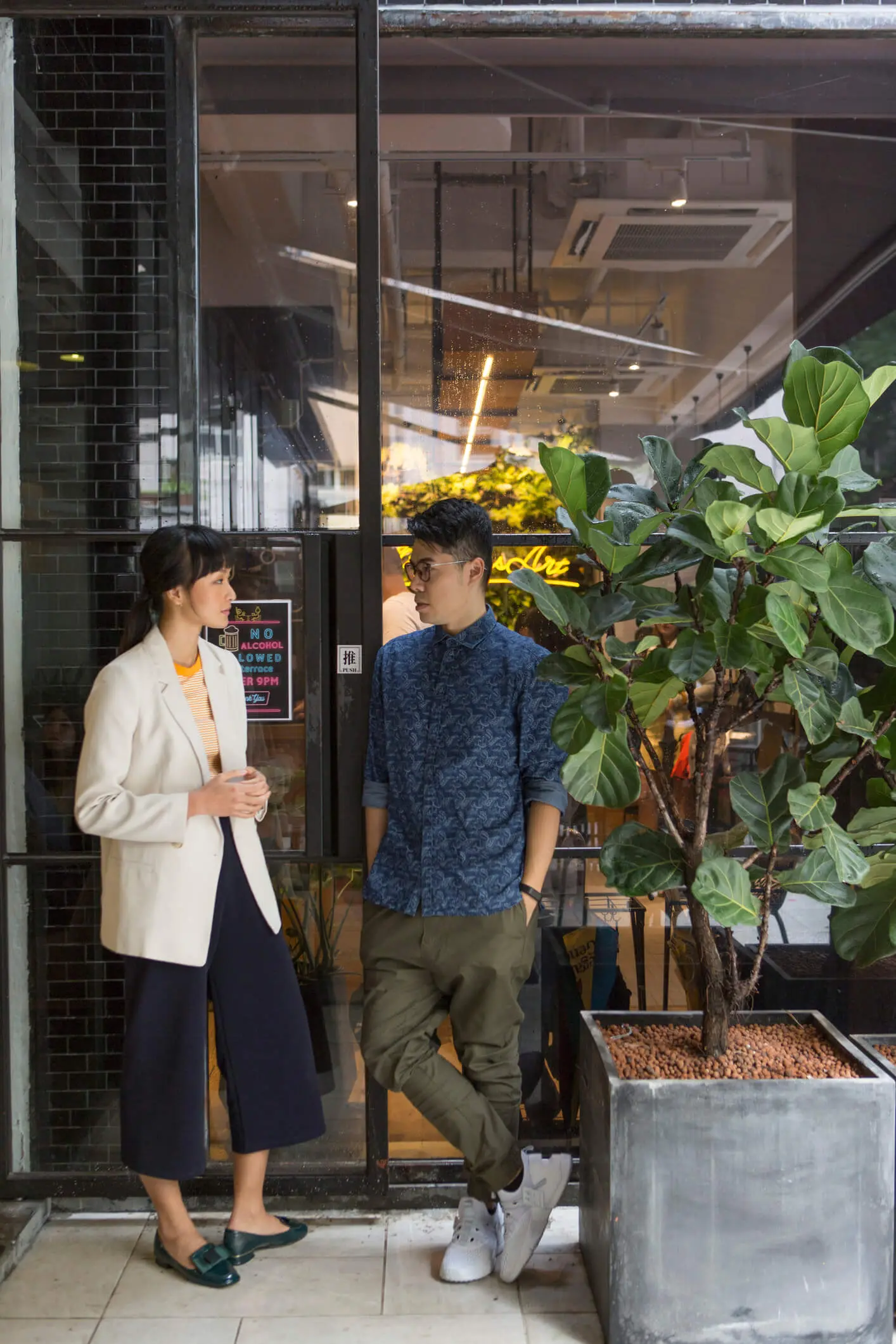 People talking outside a modern café