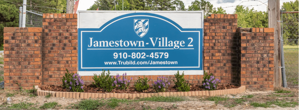 Brick sign with contact information