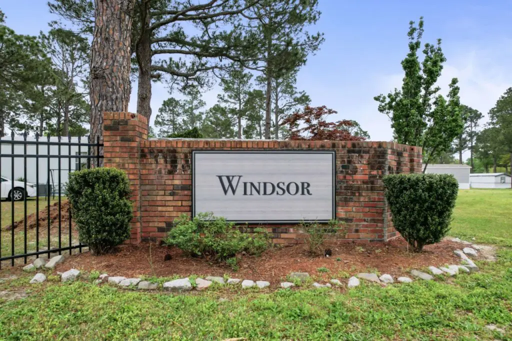 Windsor entrance sign with brick background