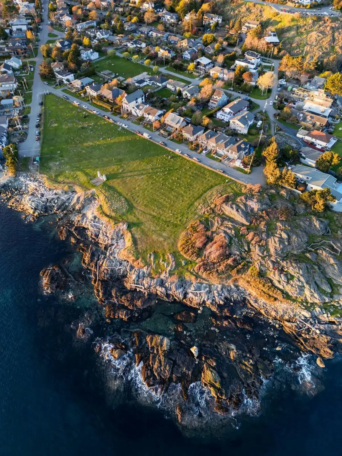 Rocky coastal headland with seaside homes